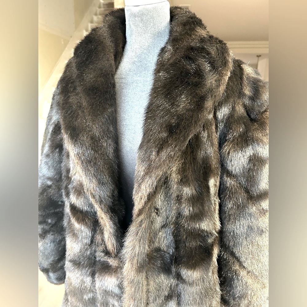 Faux fur coat brown with black shading. Never worn.